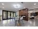 Basement living room with a fireplace and modern chairs and bar stools at 9105 Old Southwick Pass, Johns Creek, GA 30022