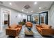 Comfortable living room with leather sofas, a modern design, and ample space for relaxation at 9105 Old Southwick Pass, Johns Creek, GA 30022
