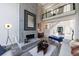 Beautiful living room with modern fireplace, high ceilings, and open concept at 9105 Old Southwick Pass, Johns Creek, GA 30022