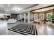 Spacious open-concept living room with modern lighting, stylish furnishings, and a cozy fireplace area at 9105 Old Southwick Pass, Johns Creek, GA 30022