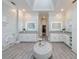 Bright and airy main bathroom with dual vanities, white cabinets, and modern fixtures at 9105 Old Southwick Pass, Johns Creek, GA 30022