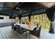 This outdoor patio with a covered dining area makes for the perfect entertainment spot at 9105 Old Southwick Pass, Johns Creek, GA 30022