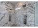 This spacious marble shower features dual shower heads with body sprays for ultimate relaxation at 9105 Old Southwick Pass, Johns Creek, GA 30022