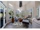 Bright sitting area features vaulted ceilings, multiple windows, hardwood floors and access to the deck at 9105 Old Southwick Pass, Johns Creek, GA 30022