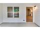 Open view from back porch through doorway, showing kitchen area in the home at 3875 Shelleydale Dr, Powder Springs, GA 30127