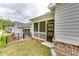 Backyard with a screened-in porch and newly installed landscaping at 3875 Shelleydale Dr, Powder Springs, GA 30127