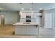Stylish kitchen with a large island, stainless steel appliances, and ample cabinet space at 3875 Shelleydale Dr, Powder Springs, GA 30127