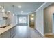 Bright living area with modern finishes, gray walls, white trim, and light wood-look flooring at 3875 Shelleydale Dr, Powder Springs, GA 30127