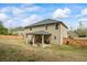 A well-kept backyard shows a covered patio with furniture, complemented by a wood fence at 4745 Prather Farm Cir, Cumming, GA 30040