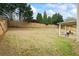Large backyard with a covered patio and a secure wooden fence offers ample space at 4745 Prather Farm Cir, Cumming, GA 30040