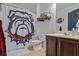 Bathroom with a unique bulldog-themed shower curtain, adding a touch of personality at 4745 Prather Farm Cir, Cumming, GA 30040