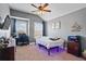 Inviting bedroom with ample natural light and a desk setup, ideal for work or study at 4745 Prather Farm Cir, Cumming, GA 30040