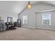 Vaulted ceiling bedroom with two windows and desk and office furniture at 4745 Prather Farm Cir, Cumming, GA 30040