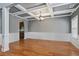 Elegant dining room with coffered ceilings, hardwood floors, and wainscoting at 4745 Prather Farm Cir, Cumming, GA 30040