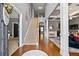 Grand foyer with hardwood floors, staircase, and an open view into the living area at 4745 Prather Farm Cir, Cumming, GA 30040