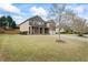 Spacious two-story home with a large front yard and a welcoming covered front porch at 4745 Prather Farm Cir, Cumming, GA 30040