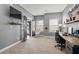 Comfortable home office with a hammock, large desk, and ample natural light at 4745 Prather Farm Cir, Cumming, GA 30040