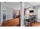 Spacious kitchen with stainless steel appliances, wood floors, breakfast bar, and convenient pantry access at 4745 Prather Farm Cir, Cumming, GA 30040