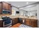 Bright kitchen with stainless steel appliances, granite countertops, and wood cabinets at 4745 Prather Farm Cir, Cumming, GA 30040