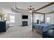 Main bedroom features a fireplace, large windows, and tray ceiling at 4745 Prather Farm Cir, Cumming, GA 30040