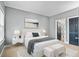 Cozy main bedroom featuring neutral decor, complemented by soft lighting and a well-furnished space at 4745 Prather Farm Cir, Cumming, GA 30040