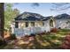A well-maintained backyard, featuring a white wooden deck perfect for outdoor relaxation and entertaining at 3027 Clove Tree Ln, Woodstock, GA 30189