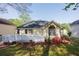 Charming backyard with a white deck that overlooks a lovely landscaped yard and lush trees at 3027 Clove Tree Ln, Woodstock, GA 30189
