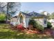 A view of the side yard with lush green grass and well-maintained landscaping, perfect for outdoor enjoyment at 3027 Clove Tree Ln, Woodstock, GA 30189