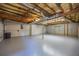 Spacious unfinished basement with exposed ceiling, concrete walls, and garage access at 3027 Clove Tree Ln, Woodstock, GA 30189