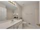 Bathroom with a sink, toilet, mirror, and walk-in shower with white tiling at 3027 Clove Tree Ln, Woodstock, GA 30189