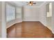 Bright dining room features hardwood floors, neutral walls, and large windows for ample natural light at 3027 Clove Tree Ln, Woodstock, GA 30189