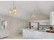 Bright kitchen featuring white counters, cabinets, vaulted ceilings, and updated appliances at 3027 Clove Tree Ln, Woodstock, GA 30189