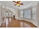 Spacious living room features hardwood floors, a fireplace, and bright windows with beautiful molding at 3027 Clove Tree Ln, Woodstock, GA 30189