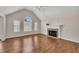Bright and airy living room with vaulted ceilings, hardwood floors, and a stone fireplace centerpiece at 3027 Clove Tree Ln, Woodstock, GA 30189
