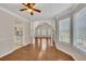 Open-concept space connecting the kitchen and living room with hardwood floors and lots of light at 3027 Clove Tree Ln, Woodstock, GA 30189