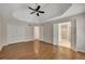 A spacious main bedroom showing hardwood floors and entrances to closets/bath at 3027 Clove Tree Ln, Woodstock, GA 30189