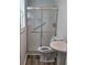 Bathroom featuring tiled shower, toilet, and new floors at 3785 Somerset Sw Dr, Marietta, GA 30064