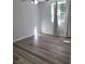 Bedroom featuring durable wood flooring, neutral walls, and ample natural light from windows at 3785 Somerset Sw Dr, Marietta, GA 30064