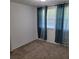 Bedroom featuring carpet, ample natural light, and a view of the yard at 3785 Somerset Sw Dr, Marietta, GA 30064