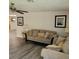 Comfortable living room with couches, neutral tones, ceiling fan and modern flooring at 3785 Somerset Sw Dr, Marietta, GA 30064