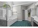 Bright bathroom boasting a walk-in shower, garden tub, arched window and double sinks at 423 Morgan Falls Chase, Canton, GA 30114