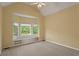 Bedroom featuring a bay window, neutral walls, neutral carpet, and storage at 423 Morgan Falls Chase, Canton, GA 30114
