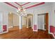 Spacious dining room featuring hardwood floors, archways, and classic design details at 423 Morgan Falls Chase, Canton, GA 30114