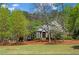Beautifully landscaped front yard highlighting a classic brick home with a welcoming entrance at 423 Morgan Falls Chase, Canton, GA 30114