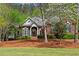 Charming single-Gathering home with a well-manicured lawn and blooming trees adding to the curb appeal at 423 Morgan Falls Chase, Canton, GA 30114