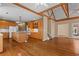 Open layout with hardwood floors throughout the kitchen, staircase, and living areas at 423 Morgan Falls Chase, Canton, GA 30114