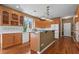 Charming kitchen featuring a center island, wooden cabinets, and hardwood floors at 423 Morgan Falls Chase, Canton, GA 30114