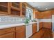 Kitchen with wooden cabinets, stainless steel appliances, and tiled backsplash at 423 Morgan Falls Chase, Canton, GA 30114