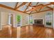 Bright living room featuring hardwood floors, fireplace, and access to the outdoors at 423 Morgan Falls Chase, Canton, GA 30114