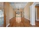 Bright living room with gleaming hardwood floors, coffered ceilings, and backyard views at 423 Morgan Falls Chase, Canton, GA 30114